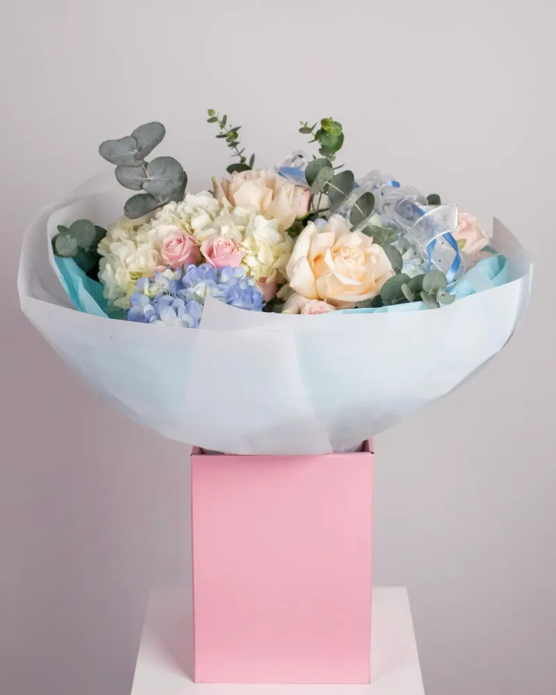 Pastel bouquet with roses, hydrangeas, and eucalyptus