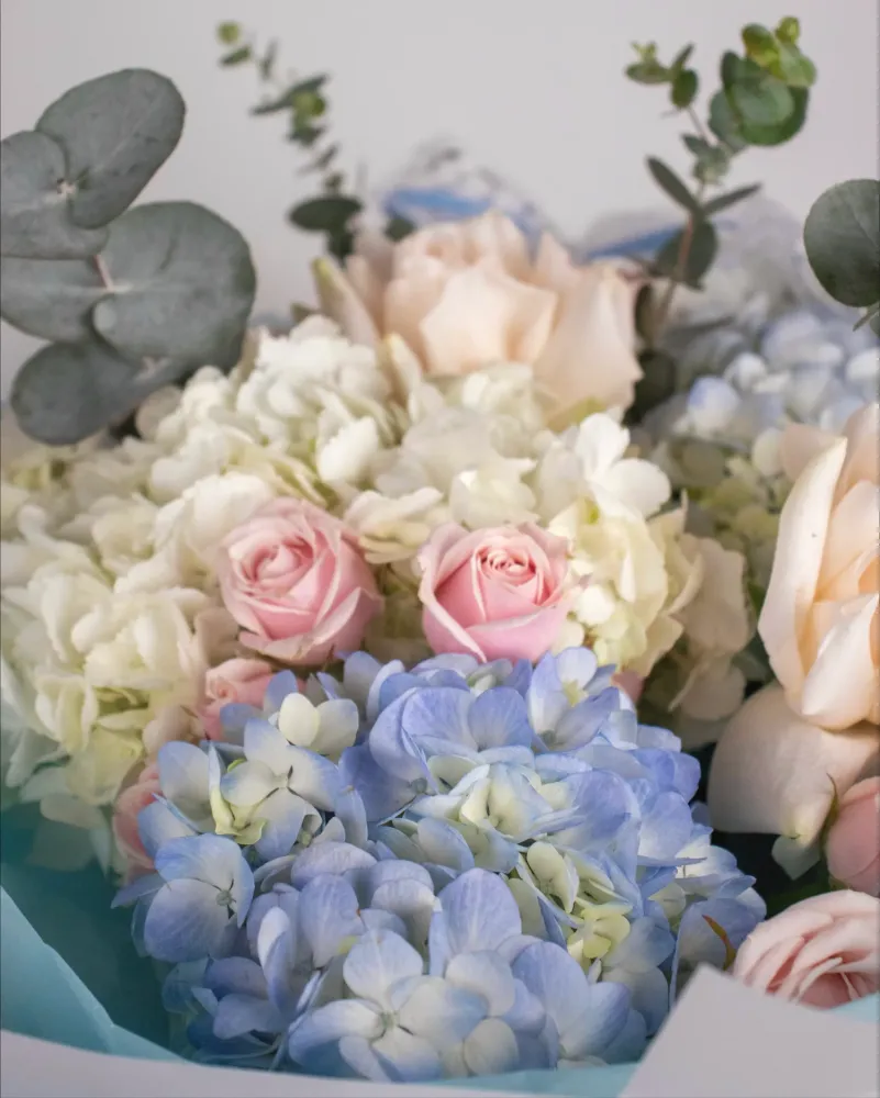 Pastel bouquet with roses, hydrangeas, and eucalyptus