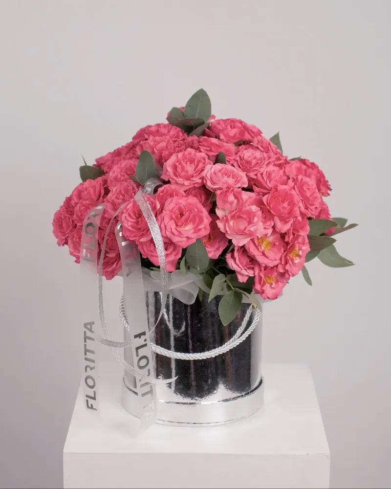 Vibrant pink rose bouquet in elegant metallic box