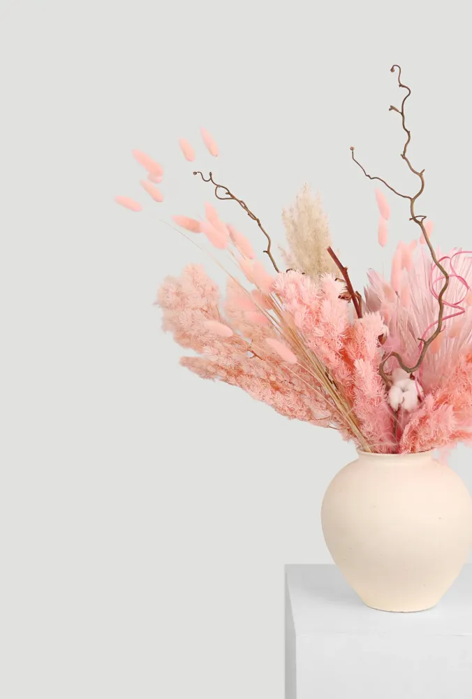 Dried floral arrangement in soft pink & beige tones