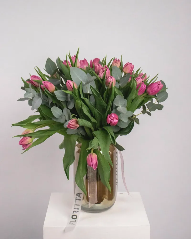 Delightful tulip and eucalyptus arrangement