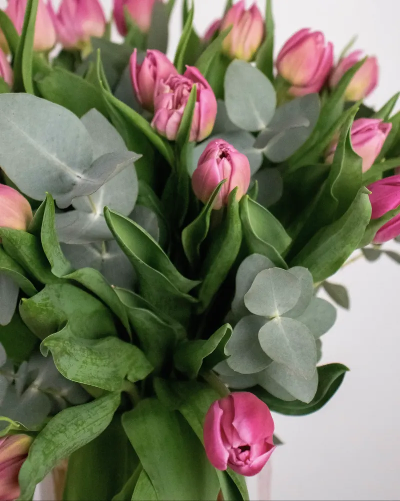 Delightful tulip and eucalyptus arrangement