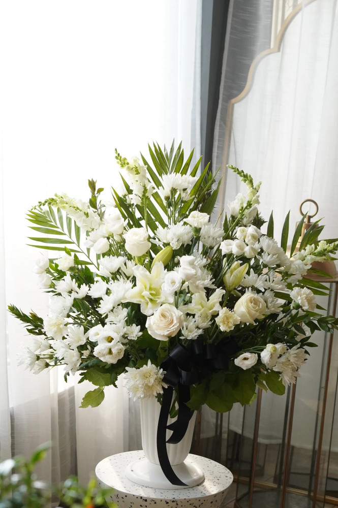 Peaceful dawn sympathy arrangement (roses, eustoma & chrysanthemums)