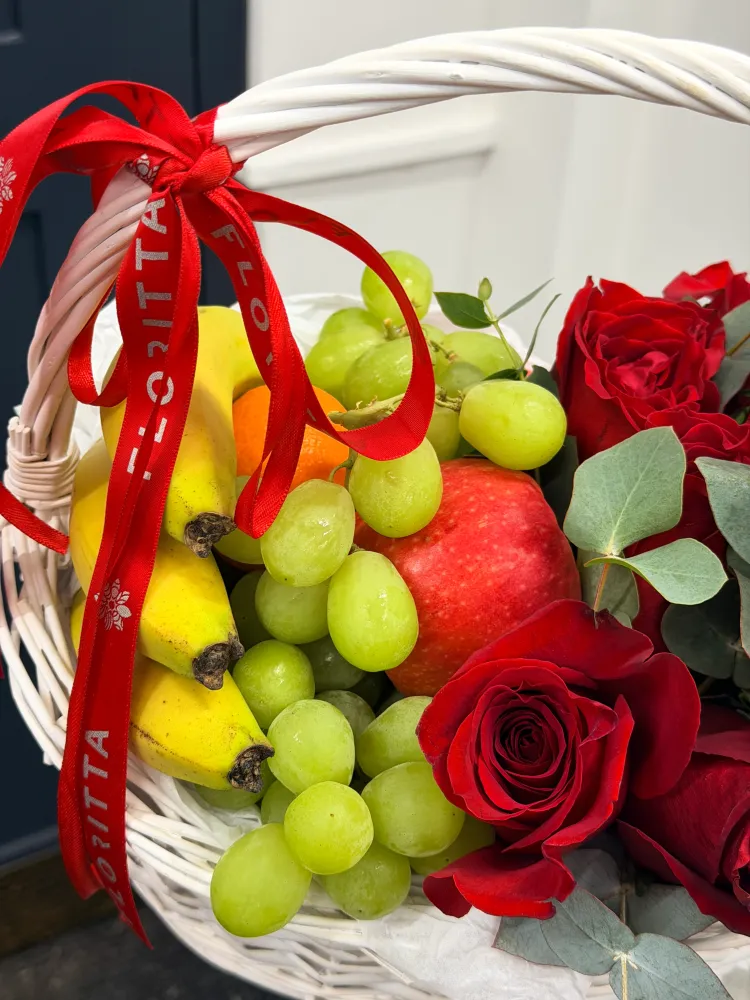 Fruits and roses in the basket