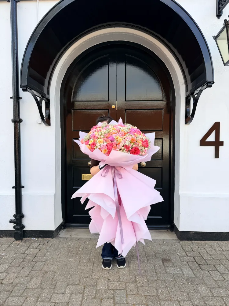 Sunset chelsea posy (rose, spray rose, carnation, gypsophila)
